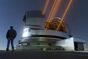 Man walking past telescope